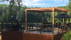 An image of the new pool near the hot tub and a view of the lake.